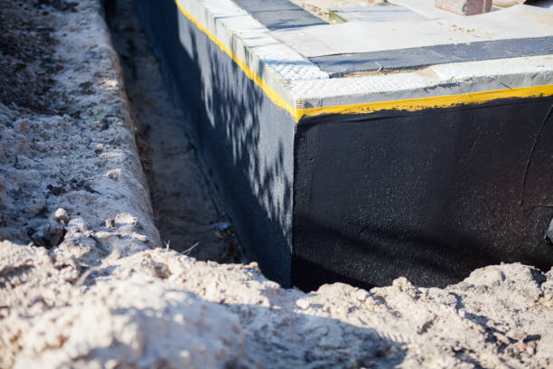 Professional Basement Waterproofing technician working in Newtonsville, OH